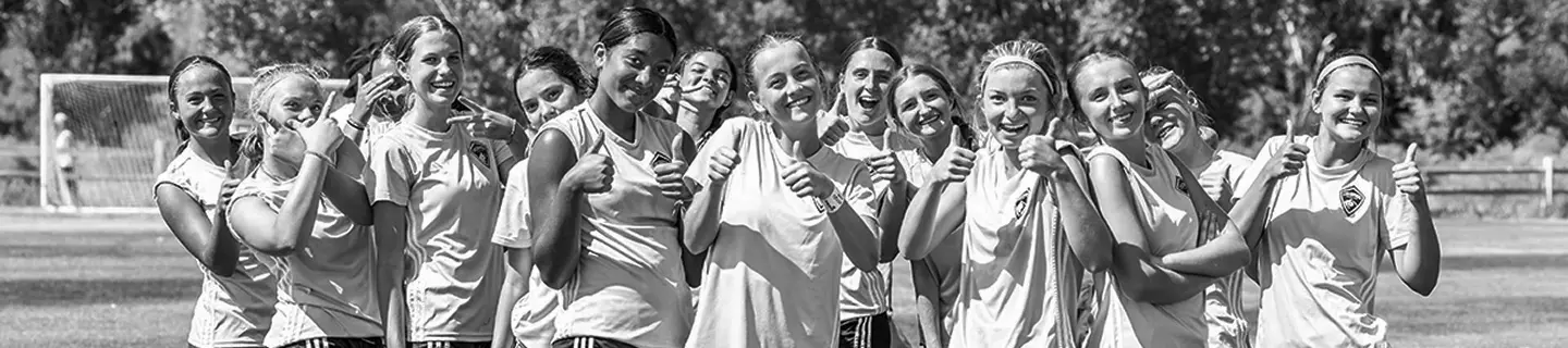 Youth soccer players giving thumbs up during a Storm training session in Colorado